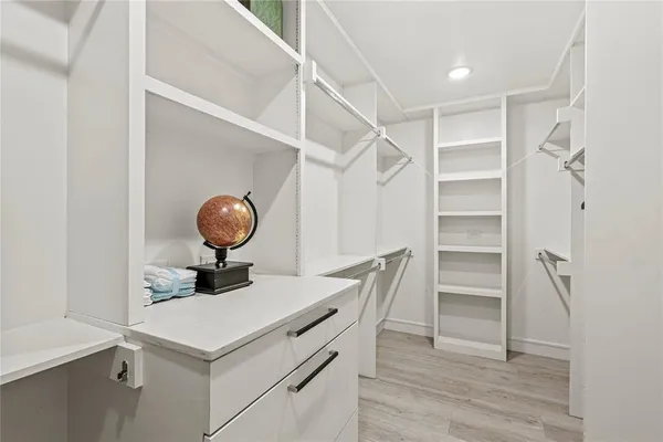 a kitchen with a cabinets and wooden floor