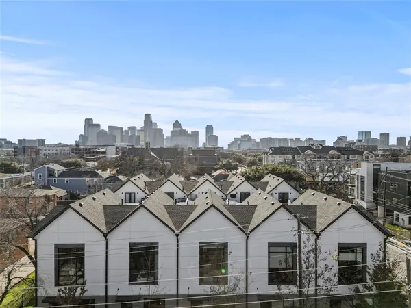 a view of a city with tall buildings in the background