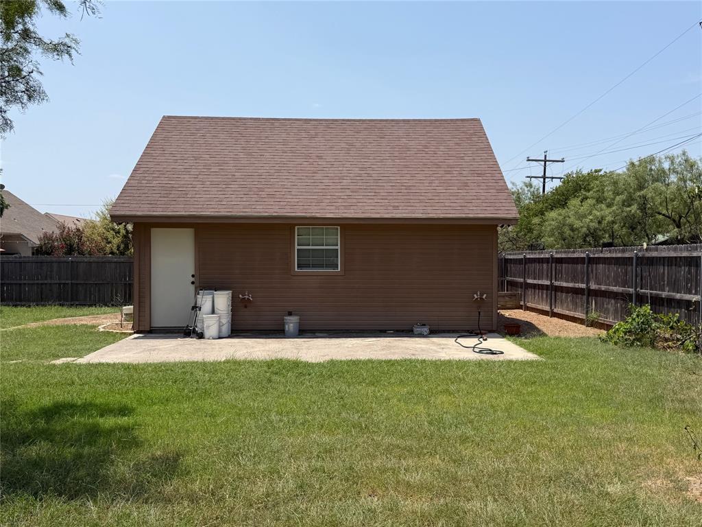 313 East River Oaks Road Early, TX 76802 - Photo 31 of 34 Shop with patio