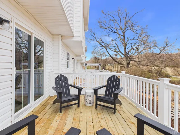 a view of two chairs in the balcony