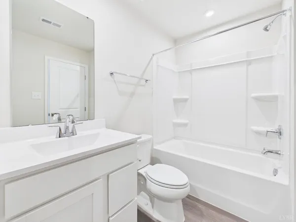 a bathroom with a sink a toilet and a bathtub