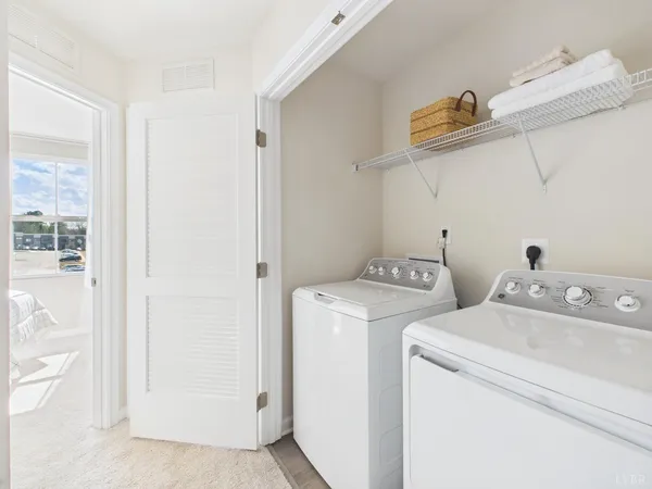 a utility room with dryer and washer