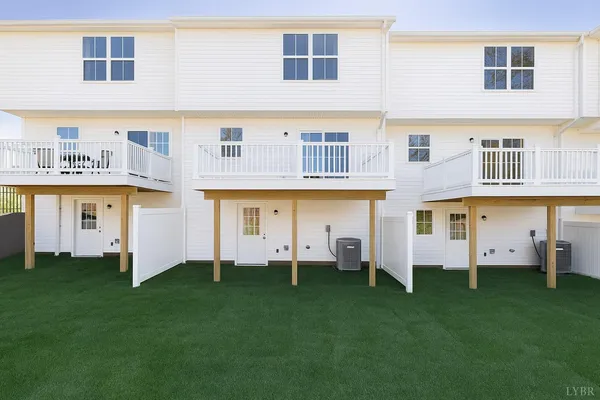 a large building with a garden and deck