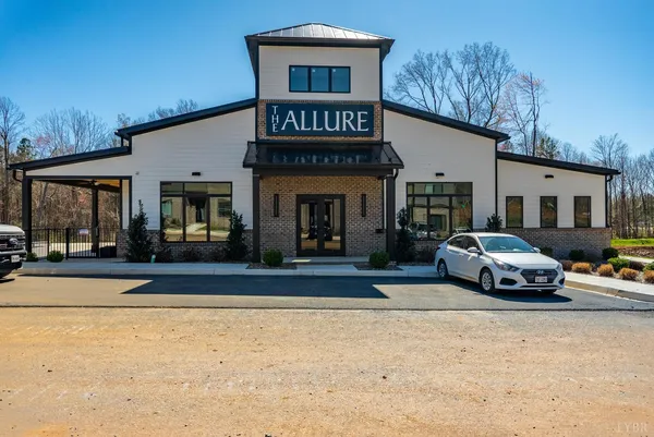 a view of a car park in front of a house