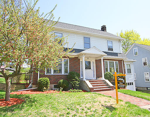 front view of a house with a yard