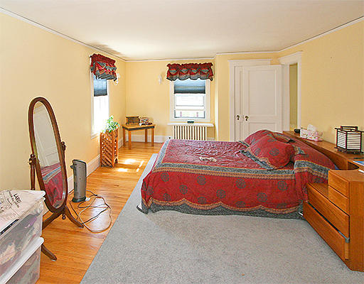 12 Lovell Road Watertown, MA 02472 - Photo 12 of 20 a spacious bedroom with a bed and a dresser in it