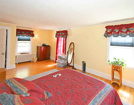 12 Lovell Road Watertown, MA 02472 - Photo 13 of 20 a bedroom with a bed and a desk