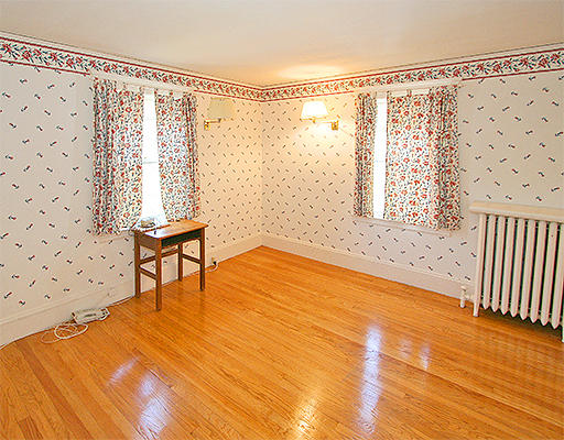 12 Lovell Road Watertown, MA 02472 - Photo 14 of 20 a view of a room with wooden floor and chair