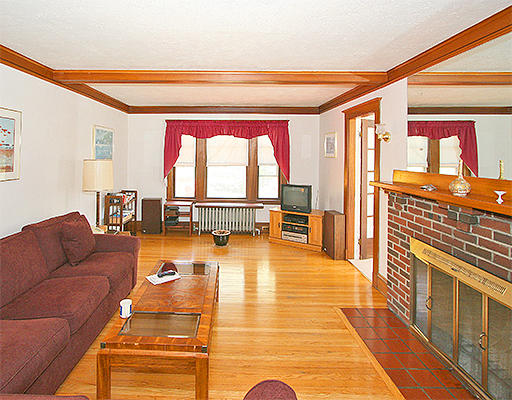 12 Lovell Road Watertown, MA 02472 - Photo 2 of 20 a living room with furniture and a large window