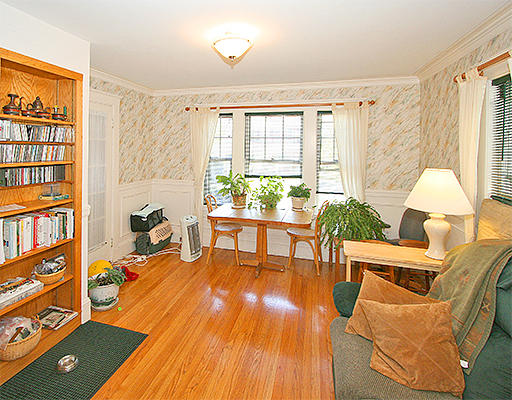 12 Lovell Road Watertown, MA 02472 - Photo 4 of 20 a living room with furniture a bookshelf and a window