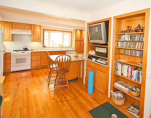 12 Lovell Road Watertown, MA 02472 - Photo 5 of 20 a living room with furniture and a table with wooden floor