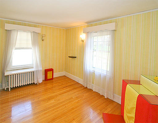 12 Lovell Road Watertown, MA 02472 - Photo 10 of 20 a bedroom with a bed and wooden floor