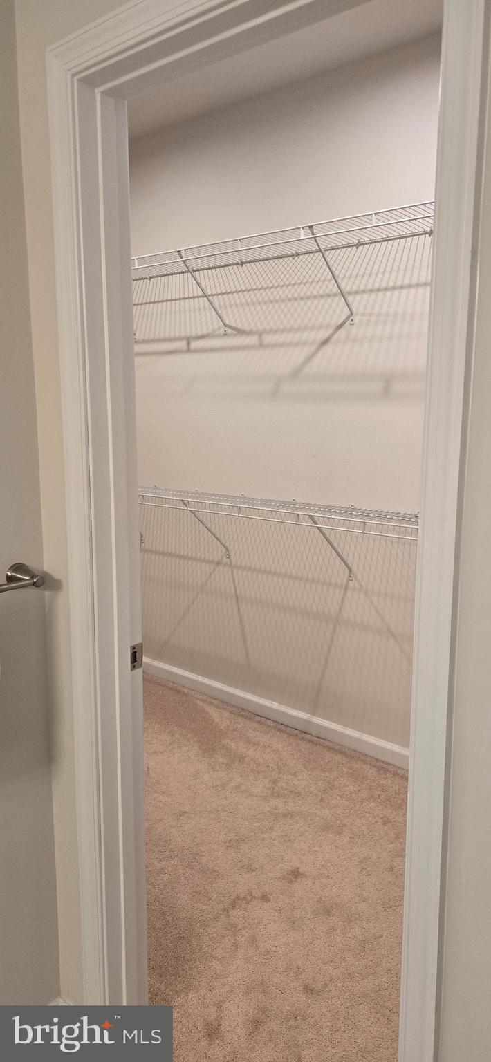 14164 Jaeger Road Clarksburg, MD 20871 - Photo 17 of 27 a bathroom with a glass shower door