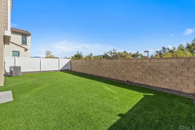 a view of a backyard with an ocean