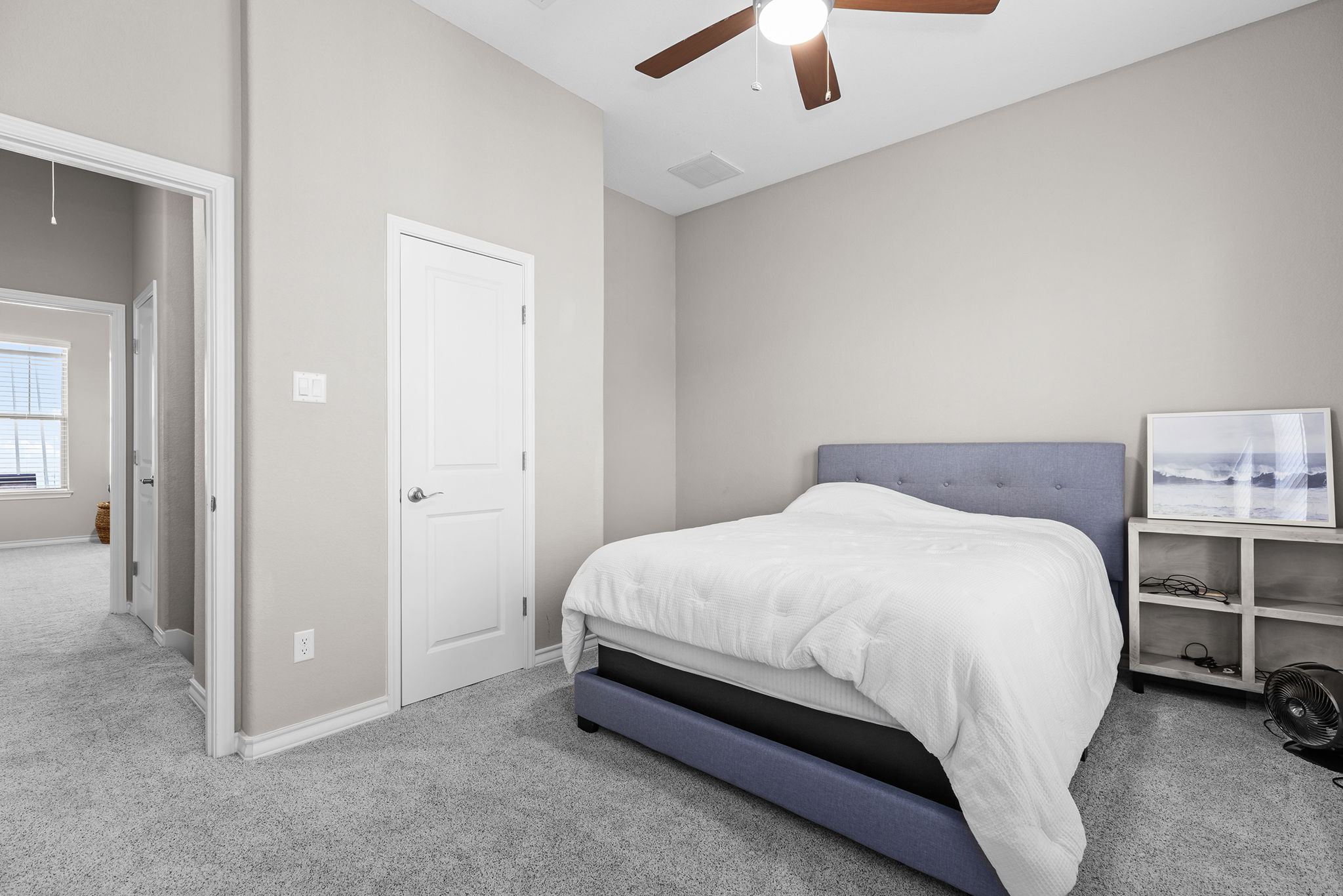 1125 Highknoll Lane Georgetown, TX 78628 - Photo 27 of 40 a bedroom with a bed and a chandelier