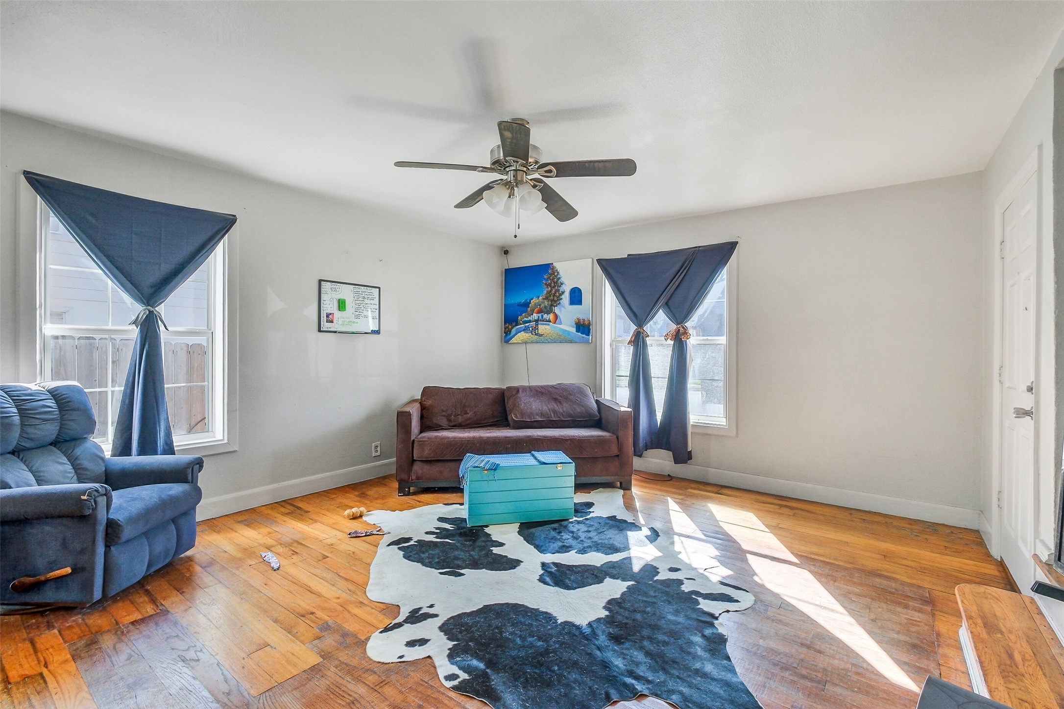 3435 Rosedale Street Houston, TX 77004 - Photo 14 of 34 a living room with furniture and wooden floor