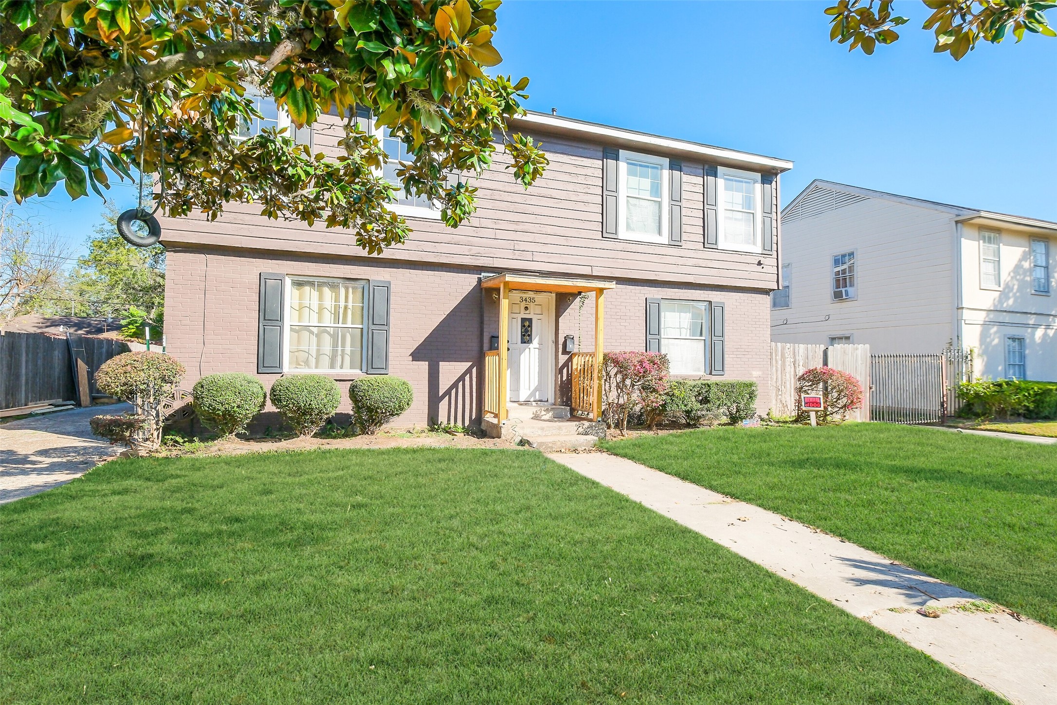 3435 Rosedale Street Houston, TX 77004 - Photo 2 of 34 a front view of a house with a yard and porch