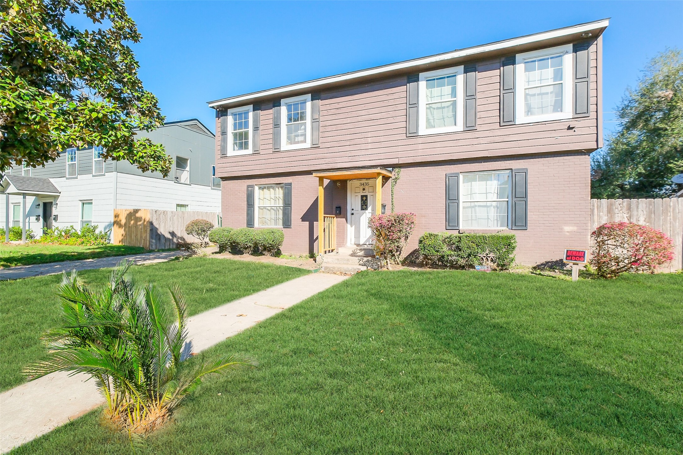 3435 Rosedale Street Houston, TX 77004 - Photo 3 of 34 a front view of a house with garden
