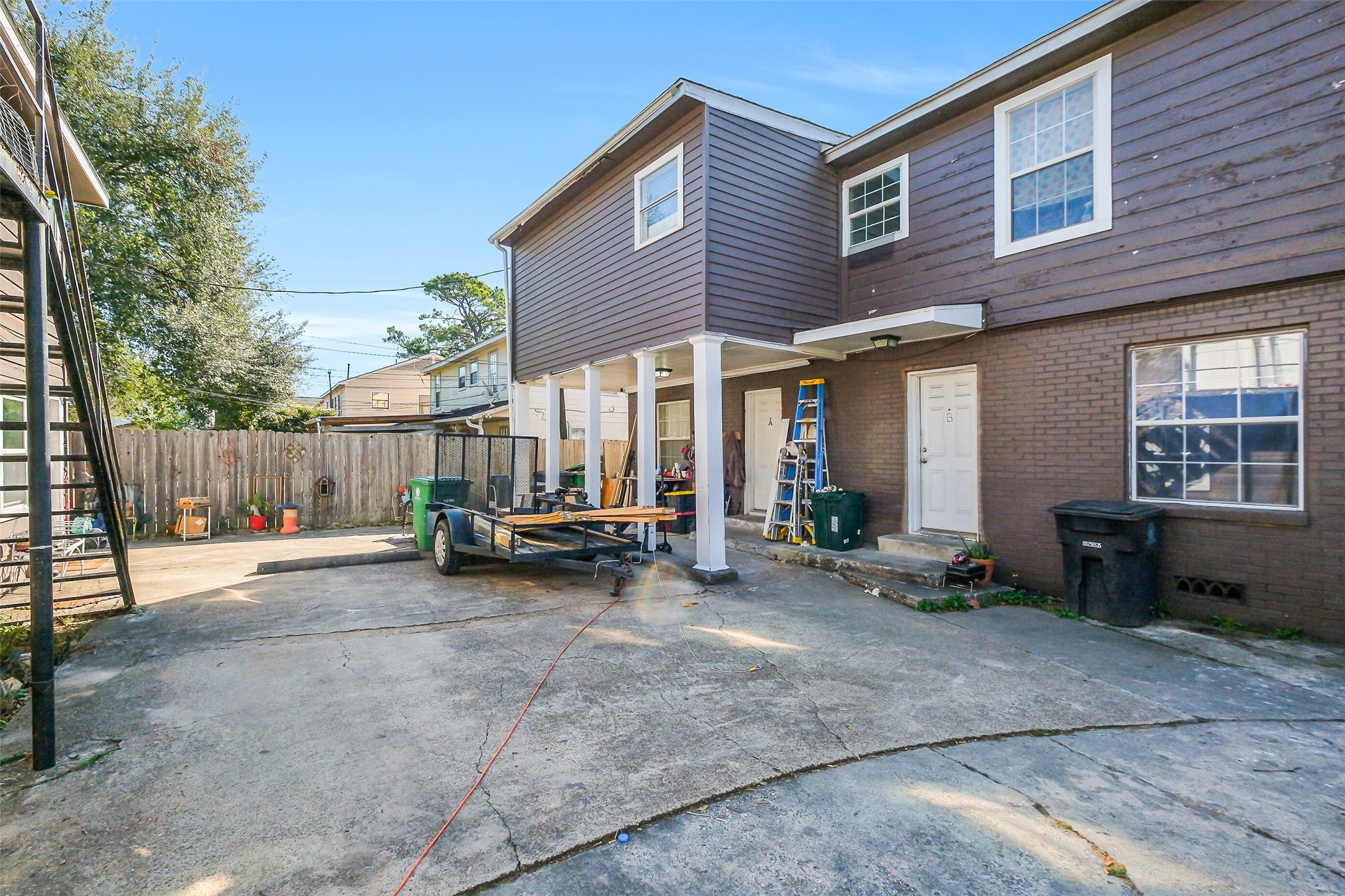 3435 Rosedale Street Houston, TX 77004 - Photo 9 of 34 a view of a house with a patio and wooden fence