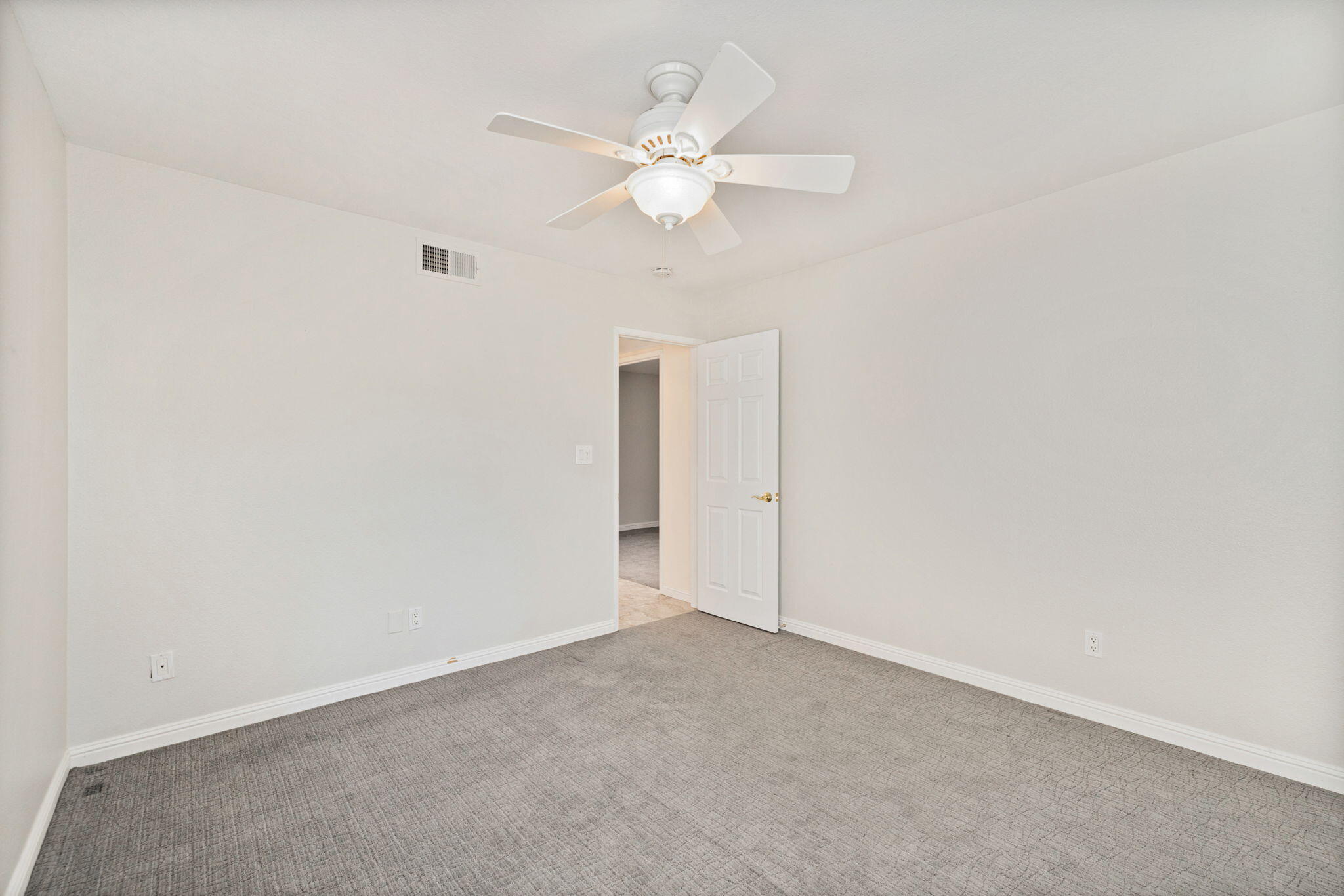 70 Durango Circle Rancho Mirage, CA 92270 - Photo 24 of 39 an empty room with a window and a ceiling fan