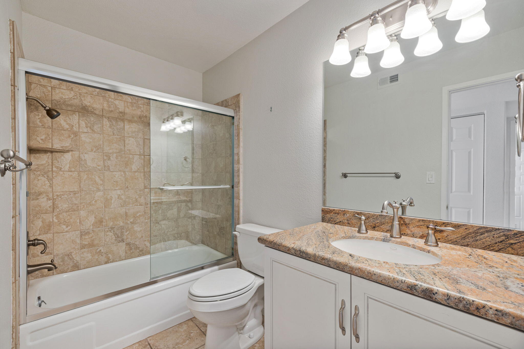 70 Durango Circle Rancho Mirage, CA 92270 - Photo 25 of 39 a bathroom with a granite countertop sink a toilet and shower