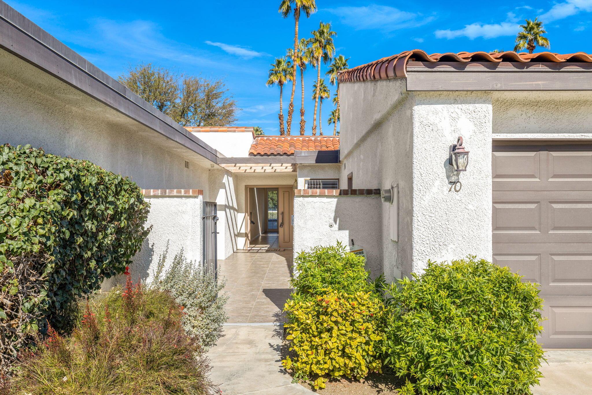 70 Durango Circle Rancho Mirage, CA 92270 - Photo 31 of 39 a front view of a house with a yard