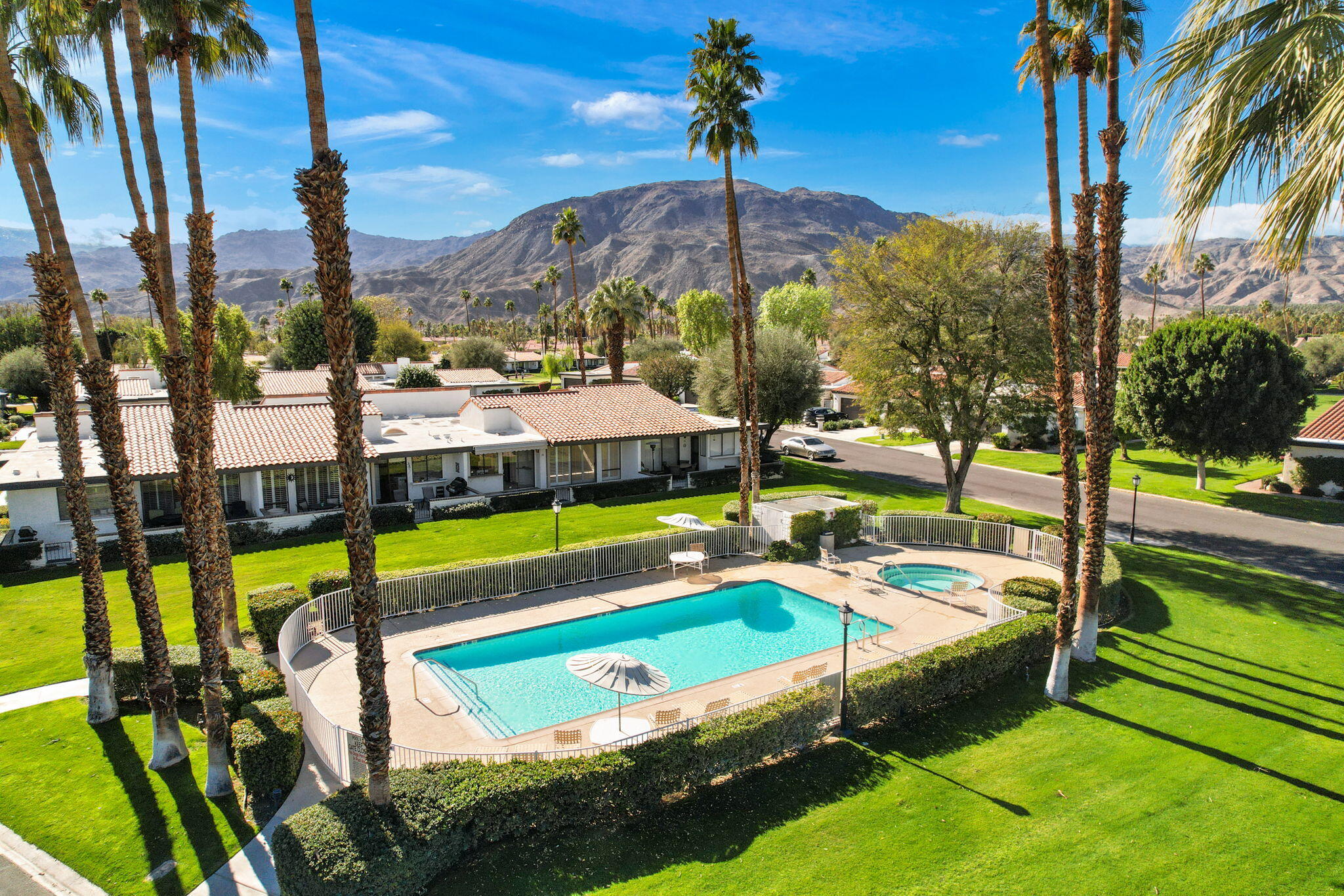 70 Durango Circle Rancho Mirage, CA 92270 - Photo 34 of 39 a view of a swimming pool with a yard and sitting area