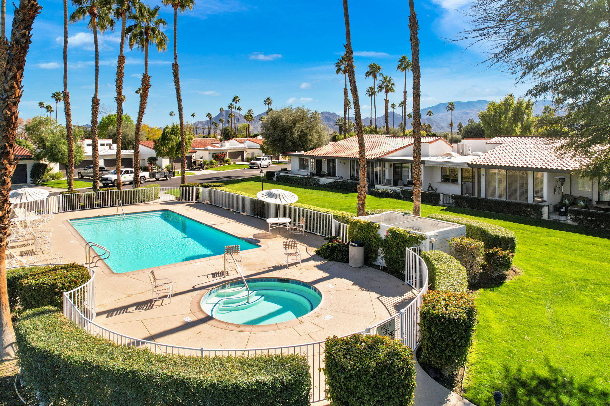 70 Durango Circle Rancho Mirage, CA 92270 - Photo 35 of 39 a view of a swimming pool with a patio and a yard