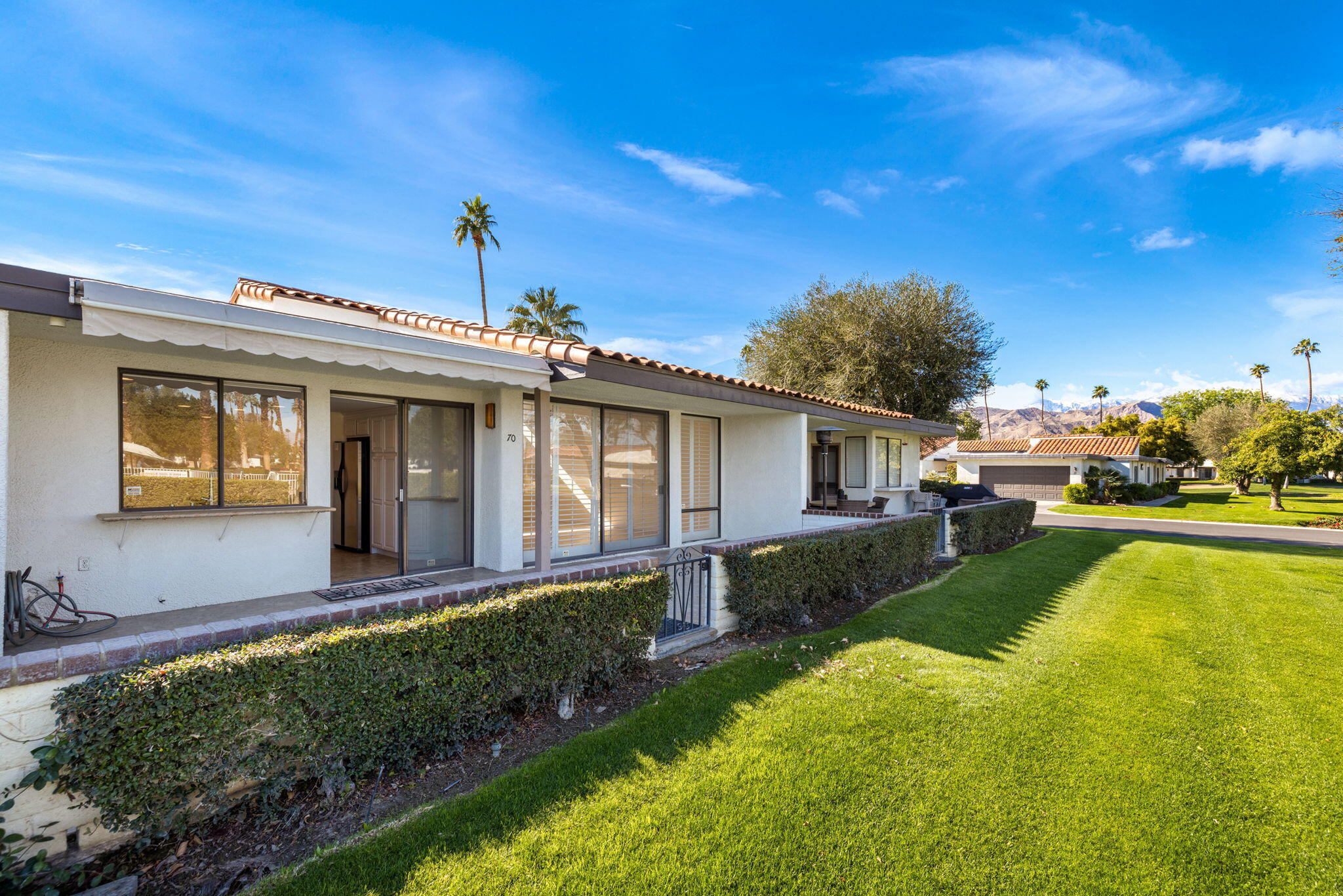 70 Durango Circle Rancho Mirage, CA 92270 - Photo 36 of 39 a view of a house with a yard patio and fire pit