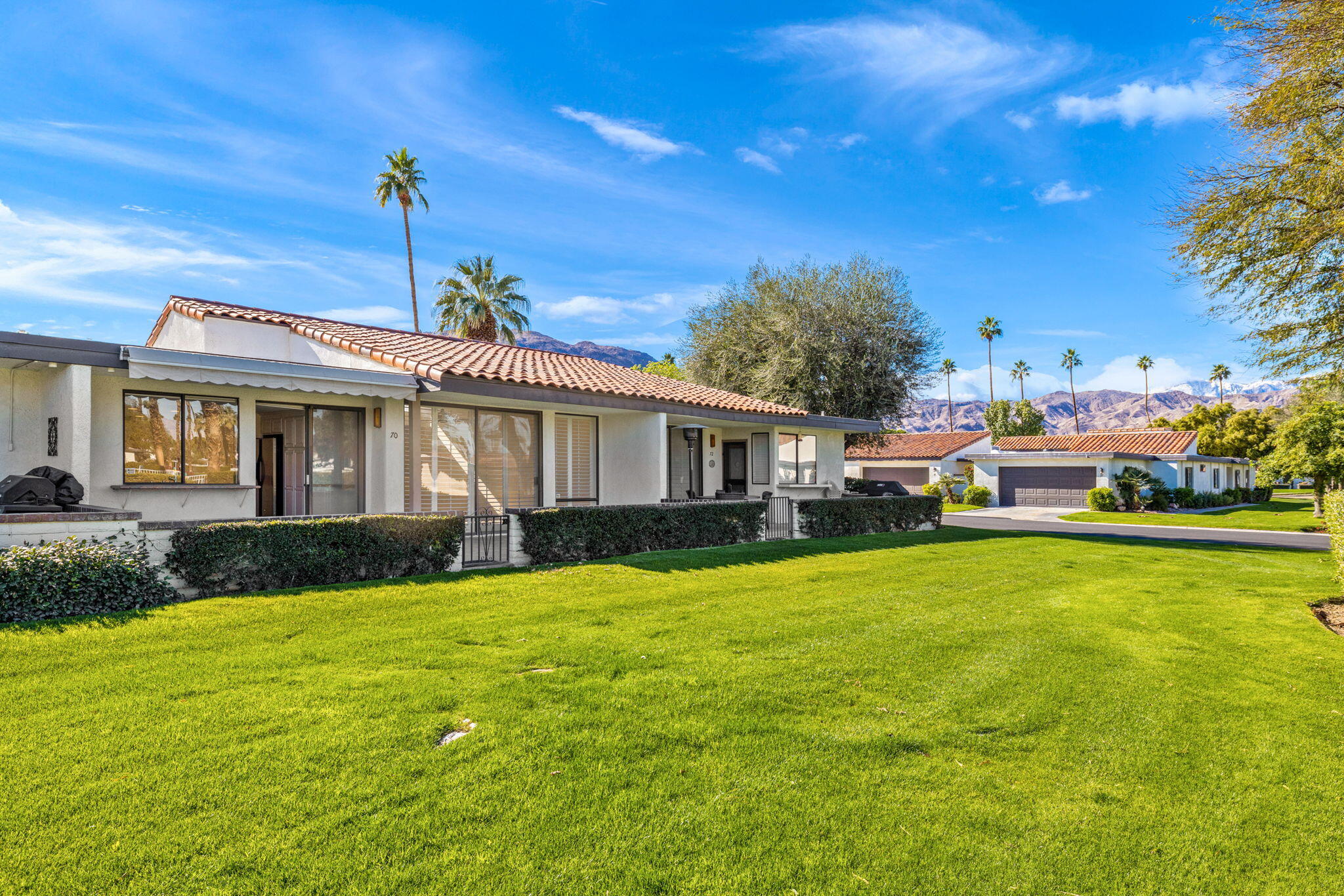 70 Durango Circle Rancho Mirage, CA 92270 - Photo 37 of 39 a front view of a house with garden