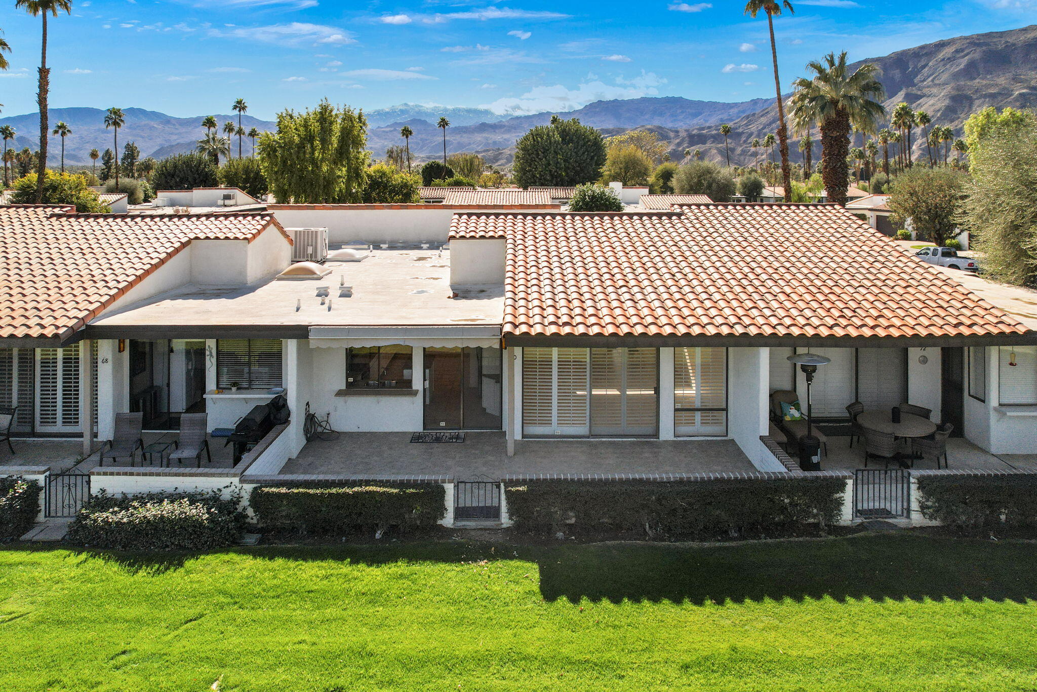 70 Durango Circle Rancho Mirage, CA 92270 - Photo 38 of 39 a front view of a house with a yard table and chairs