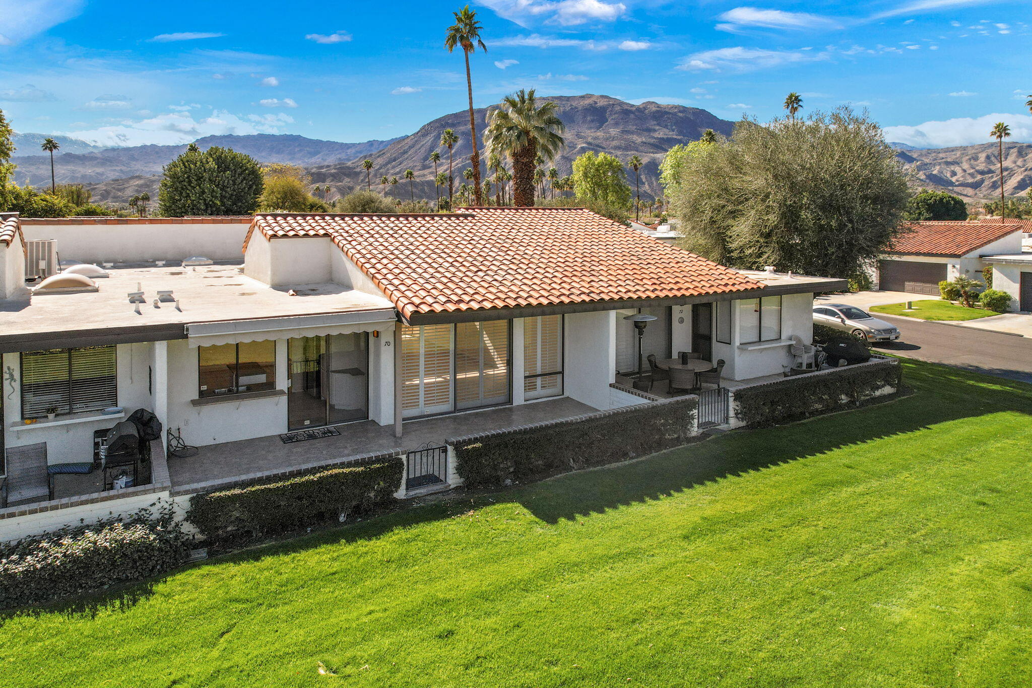70 Durango Circle Rancho Mirage, CA 92270 - Photo 39 of 39 an aerial view of a house with swimming pool garden view and a lake view
