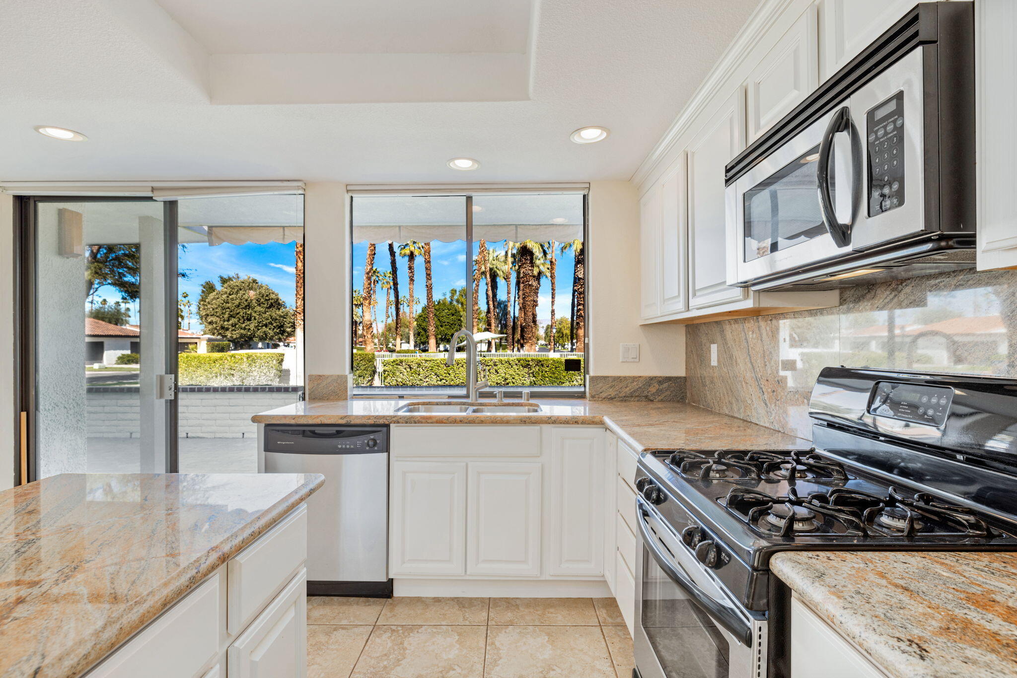 70 Durango Circle Rancho Mirage, CA 92270 - Photo 4 of 39 a kitchen with stainless steel appliances granite countertop a stove and a sink