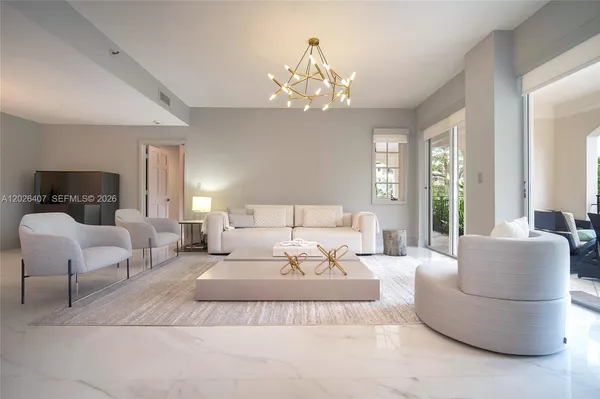 a bedroom with a large bed and a couch