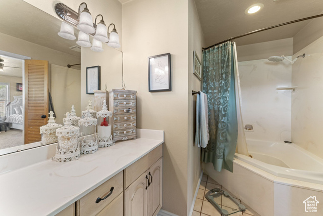 6407 North Dry Frk Cyn Road West Vernal, UT 84078 - Photo 34 of 48 Bathroom featuring tile patterned floors, shower / bath combination with curtain, vanity, ensuite bath, and baseboards