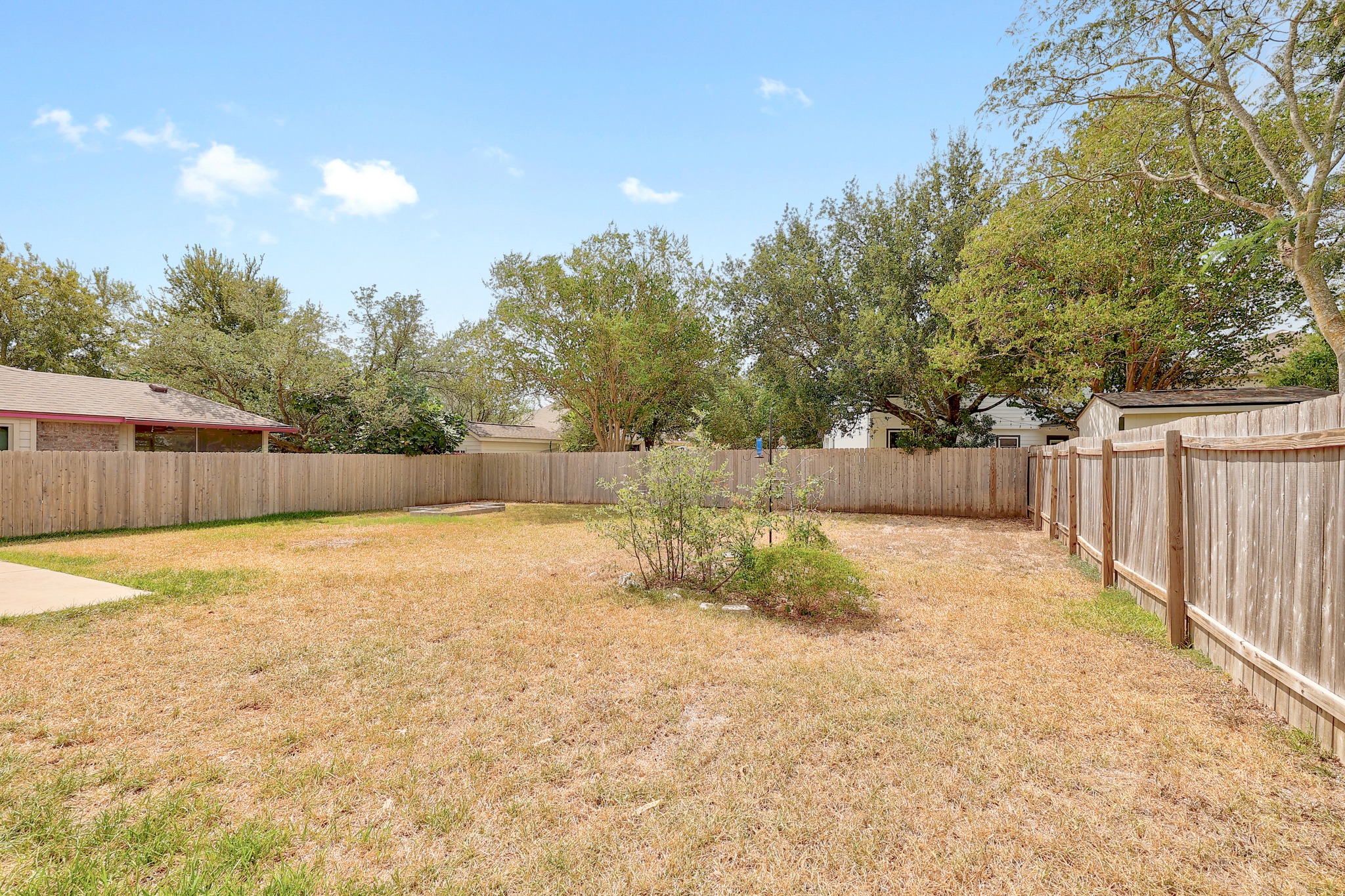 4615 Tello Path Austin, TX 78749 - Photo 30 of 31 A spacious backyard enclosed by tall privacy fencing offers plenty of room to roam.