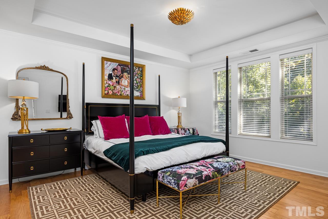 5528 Wade Park Boulevard Raleigh, NC 27607 - Photo 16 of 30 a bedroom with a bed and window