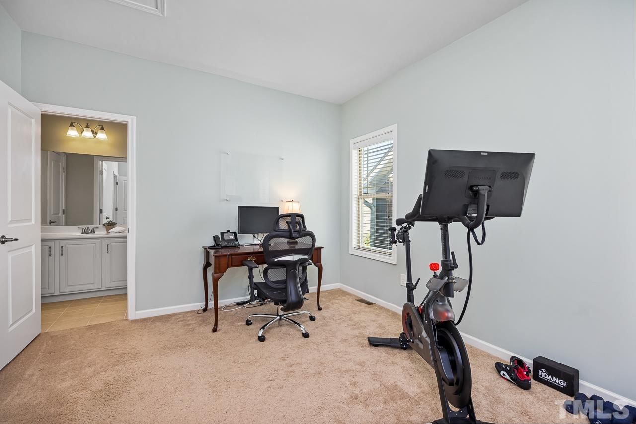 5528 Wade Park Boulevard Raleigh, NC 27607 - Photo 25 of 30 a view of a workspace with furniture and a window
