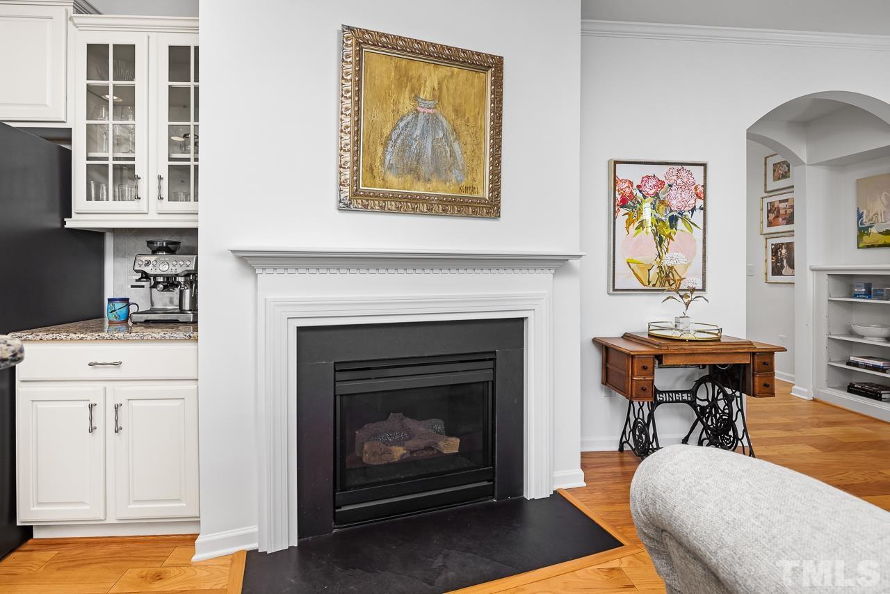 5528 Wade Park Boulevard Raleigh, NC 27607 - Photo 9 of 30 a living room with furniture and a fireplace