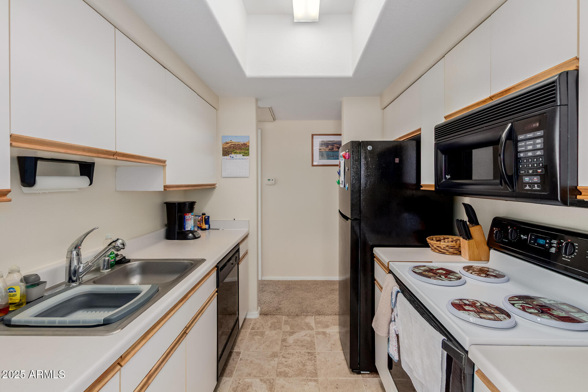 3434 East Baseline Road, Unit 246 Phoenix, AZ 85042 - Photo 11 of 43 a kitchen that has a sink and a stove top oven