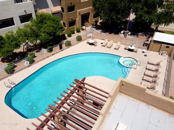 a view of a swimming pool with a lounge chair
