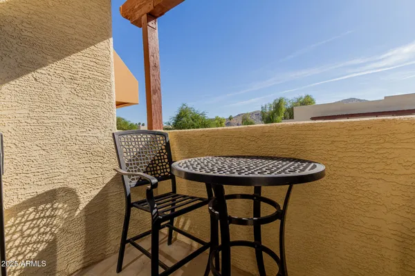 a view of balcony with furniture