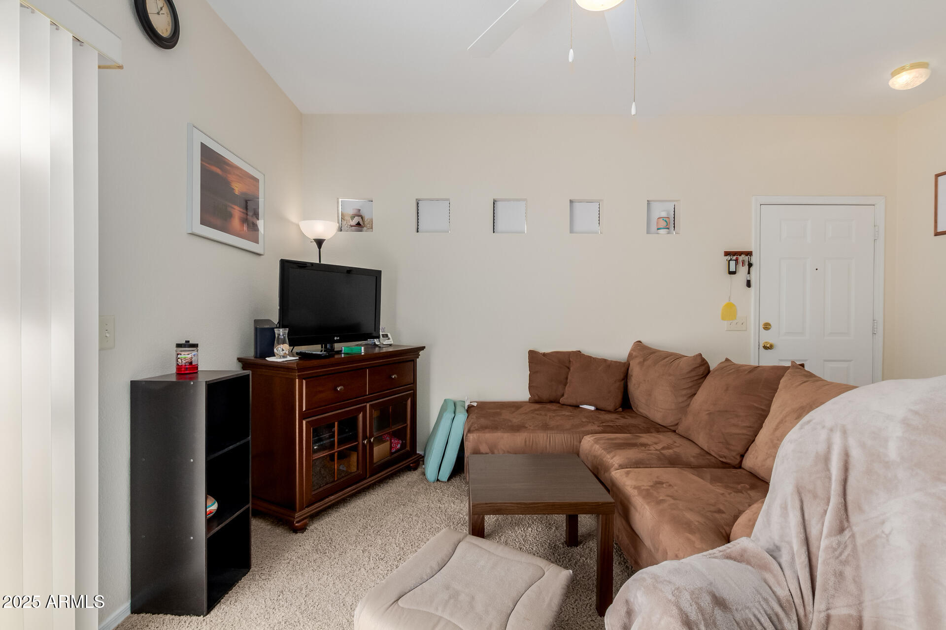 3434 East Baseline Road, Unit 246 Phoenix, AZ 85042 - Photo 8 of 43 a living room with furniture and a flat screen tv