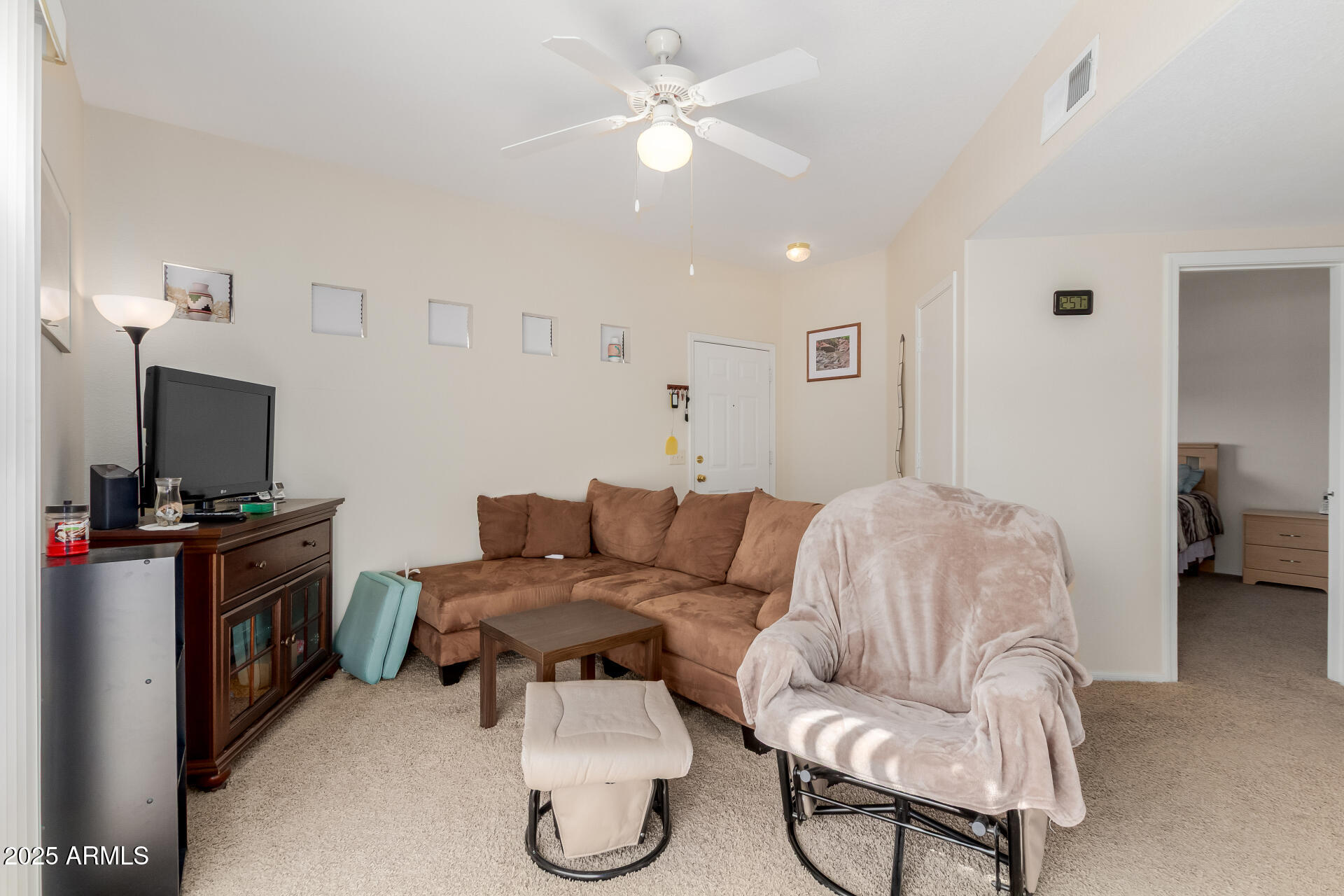 3434 East Baseline Road, Unit 246 Phoenix, AZ 85042 - Photo 9 of 43 a living room with furniture and a flat screen tv