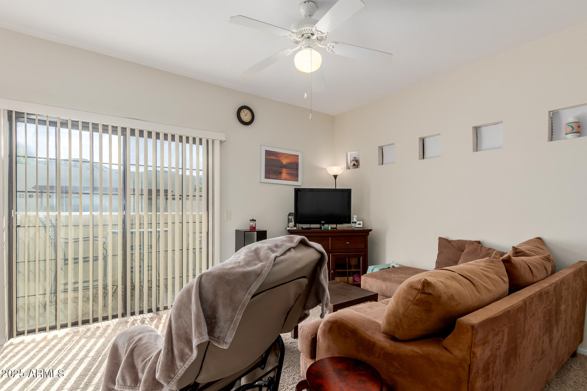 3434 East Baseline Road, Unit 246 Phoenix, AZ 85042 - Photo 10 of 43 a living room with furniture and a flat screen tv