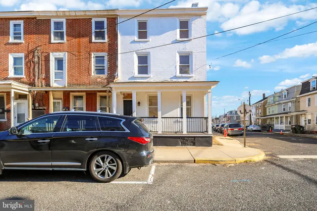 a view of road with large trees