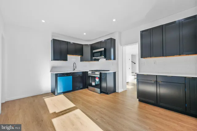 a bedroom with a bed and a television