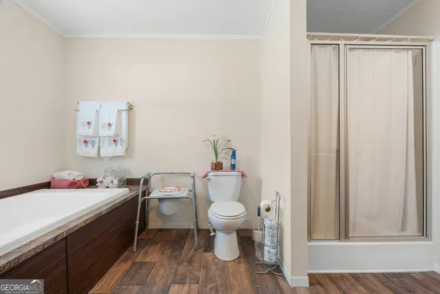 a bathroom with a toilet a sink and a window
