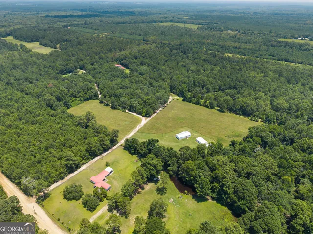 a view of a swimming pool with an outdoor space and seating area