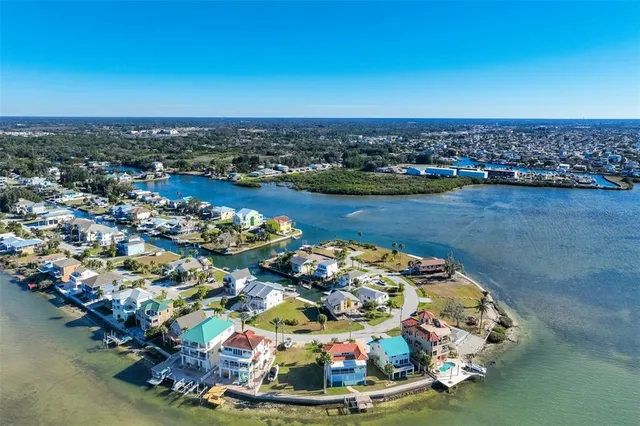 an aerial view of a house with a lake view